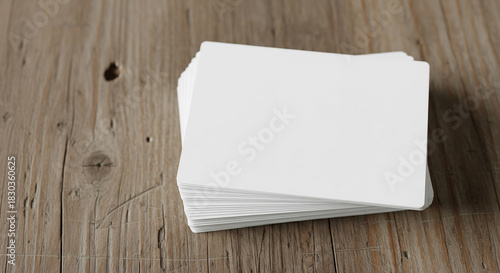 Clean Stack of Blank White Business Cards or Mockups on Rustic Wooden Table