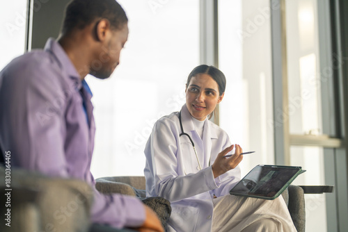 Doctor comforting depressed man during mental health consultation, showing empathy emotional support, psychiatric care and professional therapy in hospital for mental wellness, mental health awareness