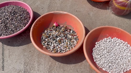 Colorful Garden Pebbles in Plastic Bowls for Landscaping and Decoration