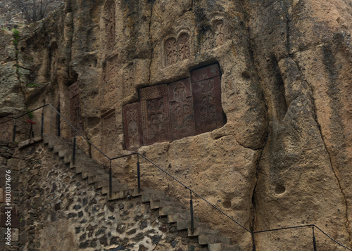 The wall with khachkars in the Geghard monastery