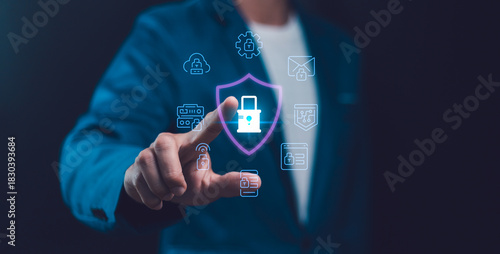 Business man ensures security and protection of digital data and network technology. Tapping a shield lock icon, symbolizing cyber privacy, access, and cloud server management system in the future.