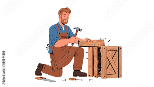 Skilled carpenter in an apron hammering a nail to assemble a wooden shipping crate