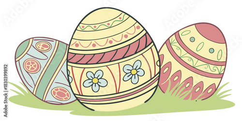 Decorative Easter eggs with floral patterns on green grass  