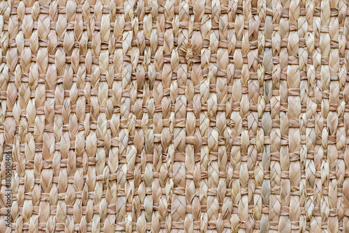 Detailed closeup of a woven basket surface, showcasing the natural texture and intricate pattern of the weaving.