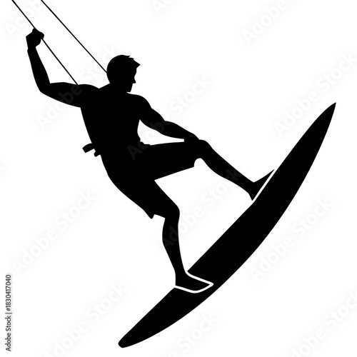 Silhouette of a man kitesurfing on a surfboard