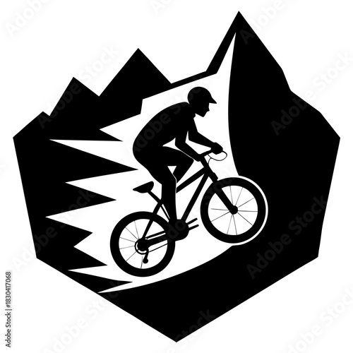 Silhouette of a mountain biker descending a steep rocky slope