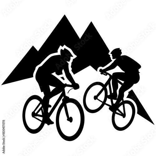 Two mountain bikers riding through mountains silhouette