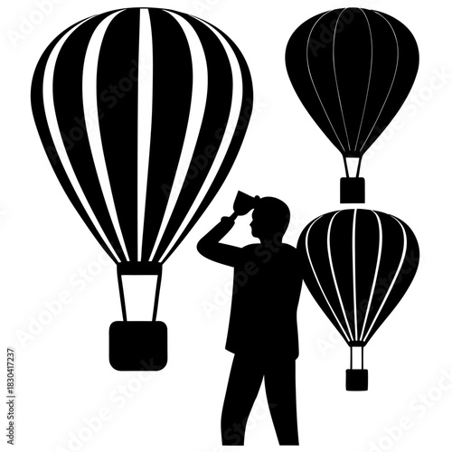 Man with binoculars looking at hot air balloons