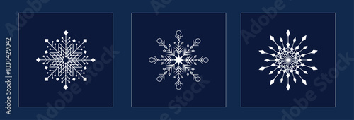 3 design of  snow flakes with crystal effect in dark blue background. 