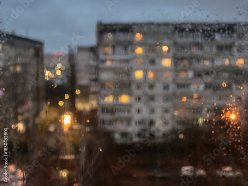 Rainy evening outside the window in the style of bokeh (blurred)