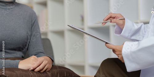 Mental Health Consultation. A doctor discussing treatment options with a patient in a calming environment.
