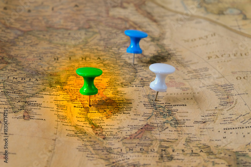 The color pins on old map,point on location.