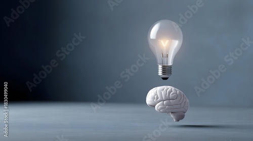 Brain and glowing light bulb symbolizing an idea