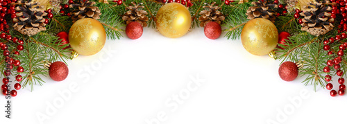 Christmas decorations with green pine twigs on white background for header or holiday card