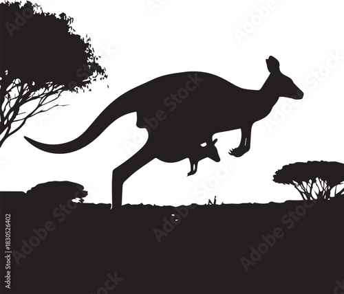 Silhouette of a kangaroo with joey jumping across the outback
