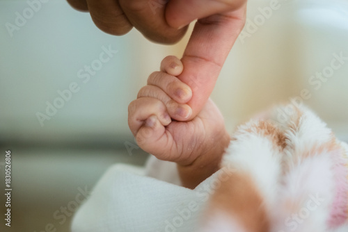 Newborn Baby Hand Holding Parent’s Finger – Close Up Bonding Moment