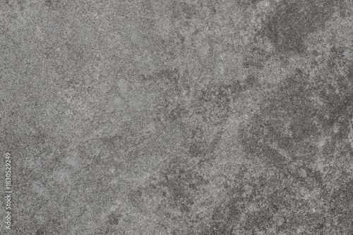 Grey stone texture background with natural grain and rough concrete surface, ideal for food photography, product presentation, design mockups, menu layouts and advertising compositions with copy space