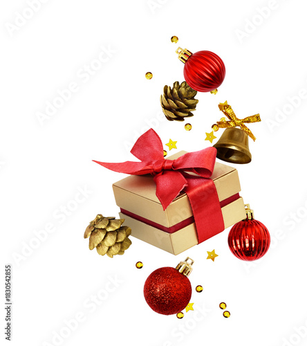 Christmas arrangement with red gift box and golden holiday decorations isolated on white or transparent background. Levitation.