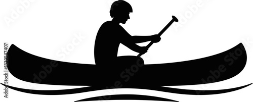 Silhouette of a person paddling a canoe on calm water