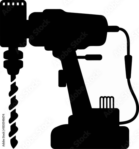 Silhouette of a cordless drill with a drill bit in action
