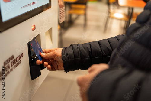 Obraz na plátně Person inserting credit card into self-service payment terminal