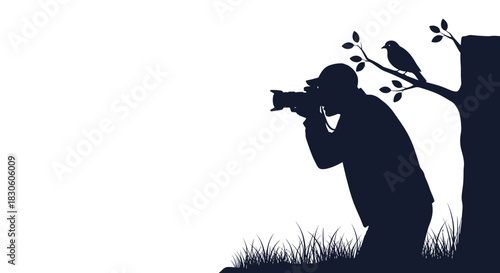 A dark silhouette of a wildlife photographer taking a picture of a small bird perched on a tree branch against a plain background.