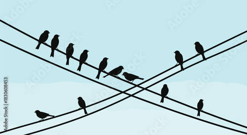 A flock of bird silhouettes perched on two intersecting power lines against a peaceful light blue sky with faint clouds.