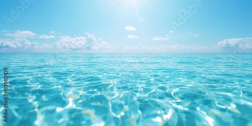 Fototapeta Naklejka Na Ścianę i Meble -  Close-up of the sparkling Mediterranean Sea with sunlight reflecting on the water, emphasizing natural light reflection for background imagery