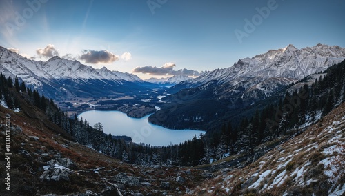 Fototapeta Naklejka Na Ścianę i Meble -  Winter scenery in a valley by a lake surrounded by mountains, seasonal change