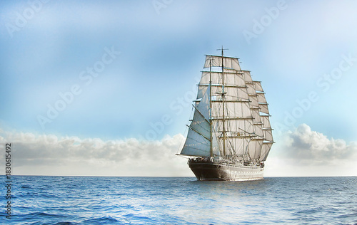 Large sailing ship navigating calm ocean under cloudy sky