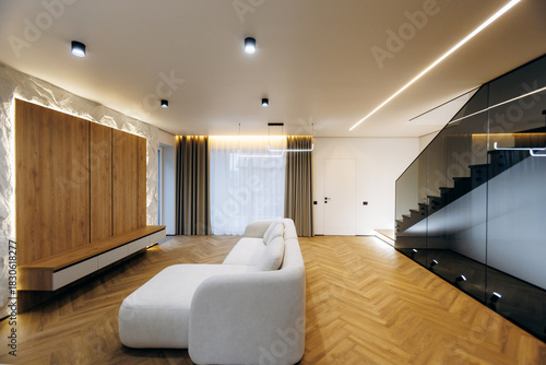 Canvastavla Stylish living space featuring curved furniture and subtle lighting