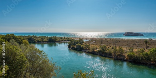 Fototapeta Naklejka Na Ścianę i Meble -  Aerial view of a beach with water and sky during summer, ideal for travel and nature photography