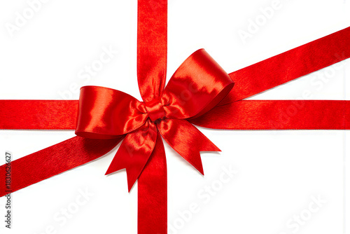 Bright red ribbon tied in a bow on a white background
