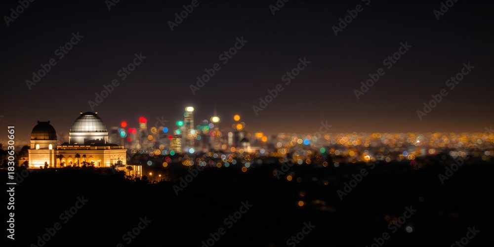Fototapeta premium Night lights at Griffith Observatory captured with blurry effect, emphasizing urban illumination at night