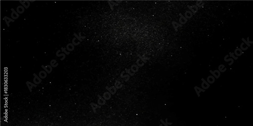 Abstract drops of rain on a dark black background texture resembling a starry night sky