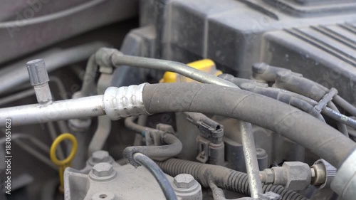 Close-Up Examination of Vehicle Engine Components: A Detailed Look at Hoses and Connectors in an Automotive Setup, Highlighting Their Importance and Functionality. Video with sound