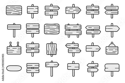 Set of wooden signposts with directional arrows and blank information boards
