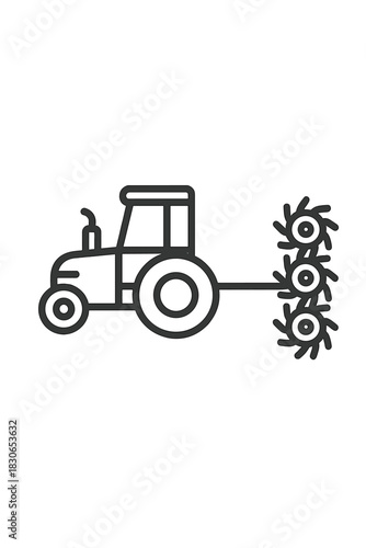 Agricultural tractor pulling a rotary cultivator implement used for tilling soil