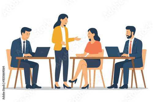 Diverse group of professional colleagues collaborating and discussing work around desks