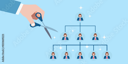 Hand with scissors cutting an organizational chart downsizing and restructuring concept