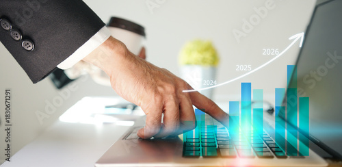 Businessman using laptop to analyze performance with business analytics dashboard. strategy planning and growth opportunities, calculating company investment