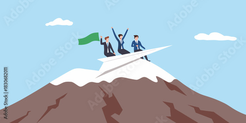 Business team celebrates reaching mountain peak on paper airplane