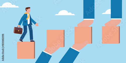 Businessman walking up stairs made of blocks held by hands