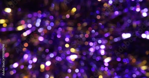 Rotating christmas purple garland decoration with bokeh effect. Great for Christmas, New Year, and celebration themes.