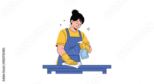 Happy woman in an apron and gloves thoroughly cleaning a table with a spray bottle and cloth as part of a professional cleaning service.