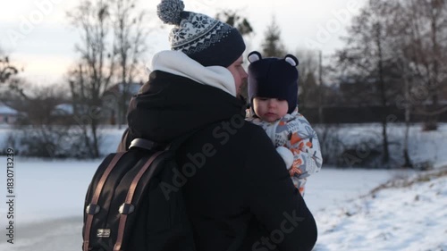 Parent and child enjoying a snowy day