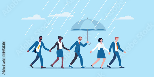 Diverse group of business people walking together under an umbrella in the rain