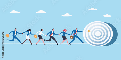 Diverse business team running together towards a bullseye target