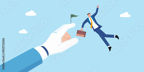 Businessman leaping towards a flag held by a giant hand