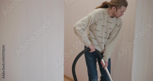 Man Vacuuming Floor at Home 4K 10-bit